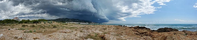Seascape with view of the coast. Storm sky with lightning, Pamoramic view