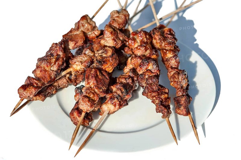 Lamb kebab shashlik from the grill on a wooden skewer