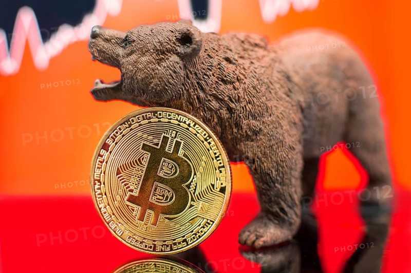 Bitcoin with a red chart drop. Price crash and bear market trend concept
