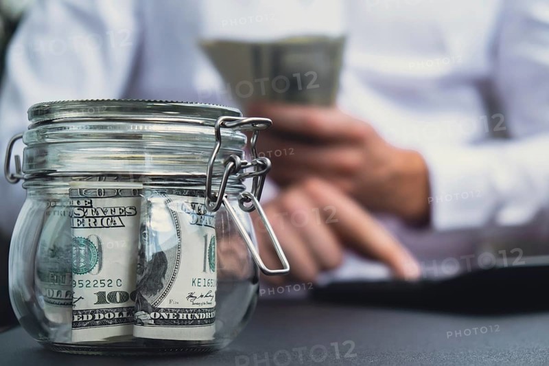 Man hands counting expenses banknotes of dollar cash on calculator. Close up of hands unrecognizable Businessman. Save up budget investment concept. American bucks fund savings concept