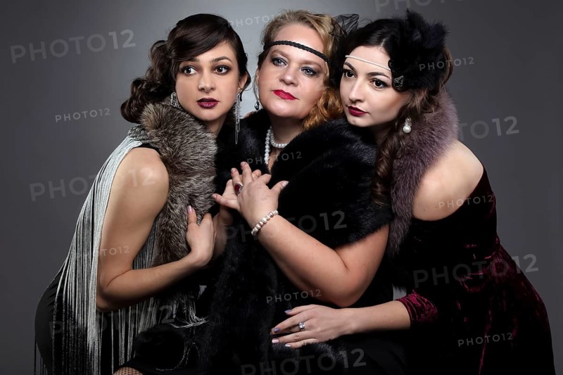 Three woman in vintage style. The people are stylised for the era of the 20s or 30s