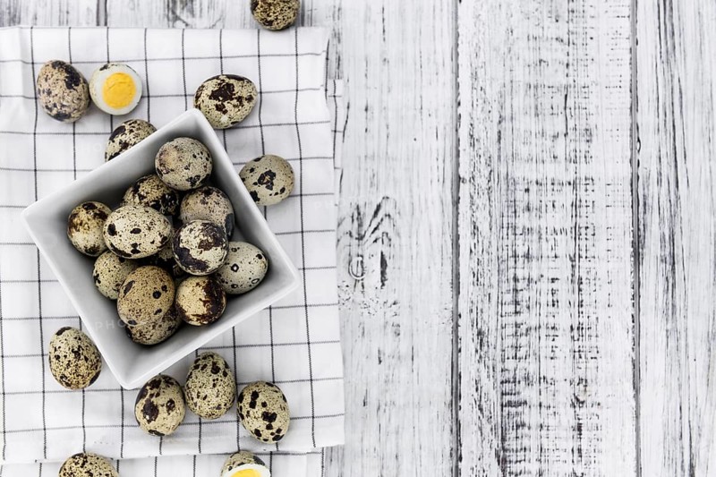 Quail Eggs (fresh) as detailed close-up shot, selective focus)