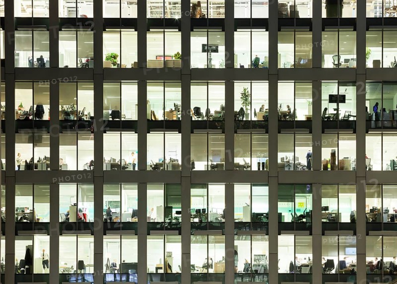 Modern office at night, showing the daily activity of office workers