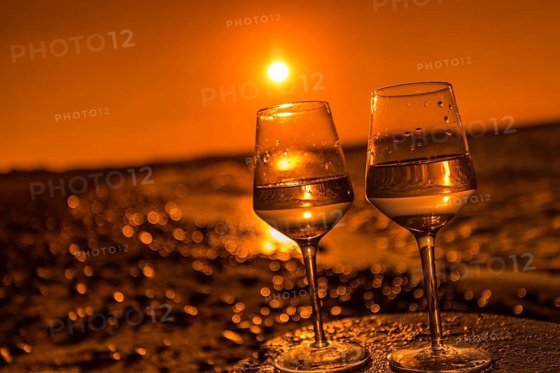 Wine on the baltic sea beach at sunset