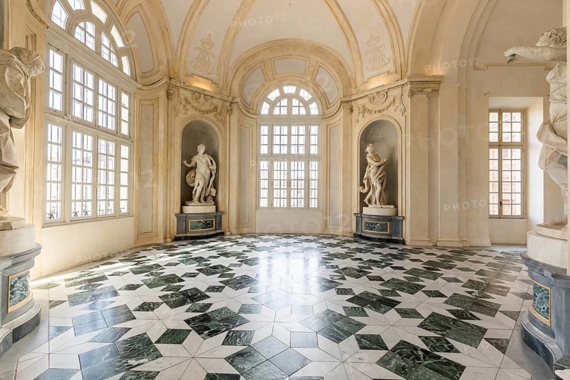 Venaria Reale, Italy, January 2023: luxury interior old royal palace. Gallery perspective with window, Europe