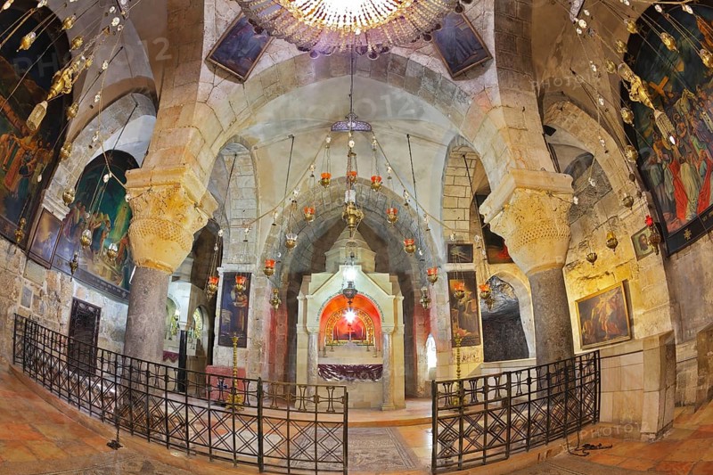 Jerusalem - September 3: Hall of the Holy Sepulchre in September 3, 2012 in Jerusalem. Ornate underground hall in the Temple. Marble columns, semicircular niche - the altar, ancient paintings of biblical scenes