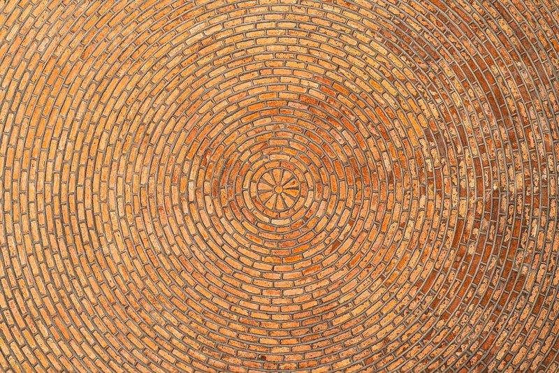 Red brick vault. Ceiling. Architectural Texture. Brick background Circular pattern