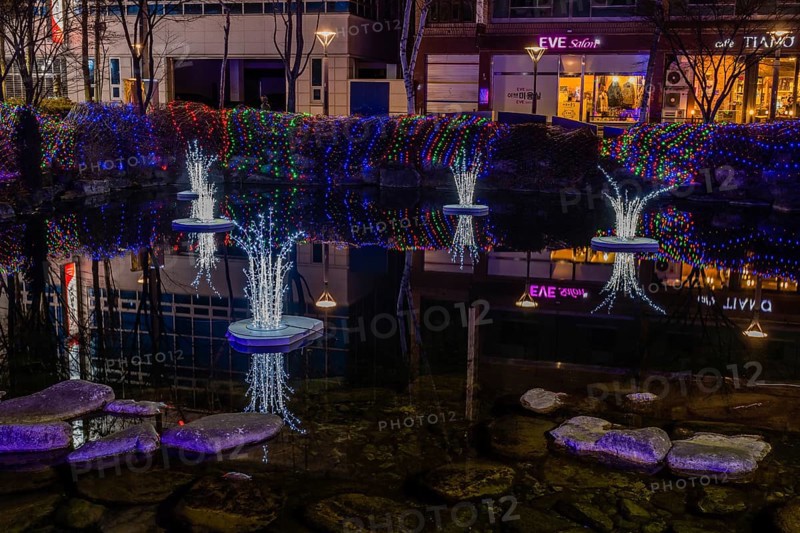 Taebeck, South Korea. January 29, 2019: Night view of light sculptures in pond during winter festival