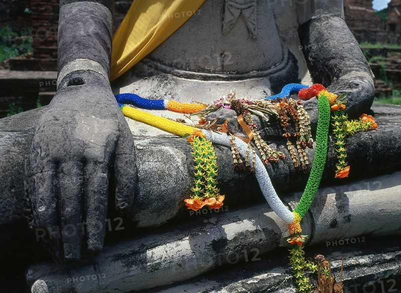 Wat Phra Mahathat was built during the reign of Borommaracha I (Boromma Rachathirat I) or Khun Luang Pa Ngua (1370- 1388), who was the third king of the Ayutthaya Kingdom.<br/><br/> Ayutthaya (Ayudhya) was a Siamese kingdom that existed from 1351 to 1767. Ayutthaya was friendly towards foreign traders, including the Chinese, Vietnamese (Annamese), Indians, Japanese and Persians, and later the Portuguese, Spanish, Dutch and French, permitting them to set up villages outside the city walls. In the sixteenth century, it was described by foreign traders as one of the biggest and wealthiest cities in the East. The court of King Narai (1656–1688) had strong links with that of King Louis XIV of France, whose ambassadors compared the city in size and wealth to Paris