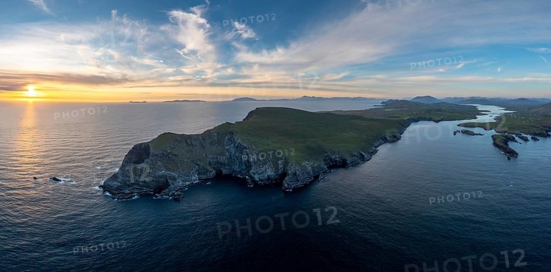 An aerial panorama view of the Bray Head cliffs and headland on Valentia Island at sunset