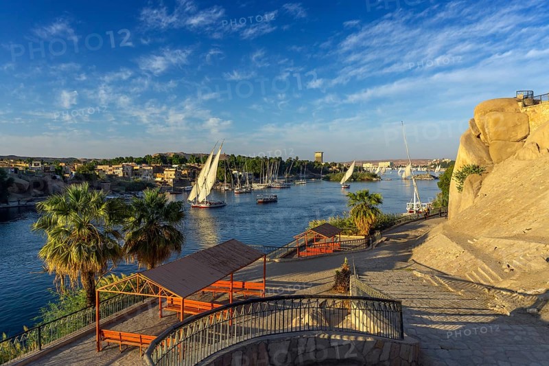 Beautiful landscape with felucca boats on Nile river in Aswan at sunset, Egypt, Africa