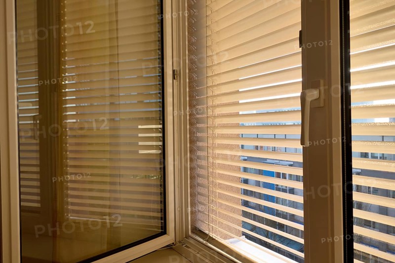 Blinds are fitted to a window to protect against heat and sun. Austria