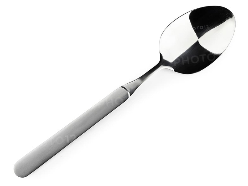 Single soup spoon over the white background