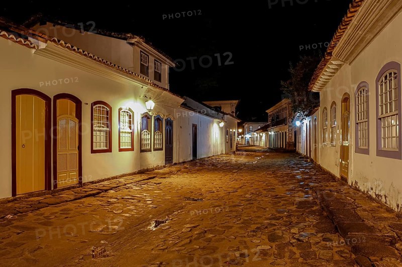 Atmospheric night view of illuminated street and buildings in historical center of Paraty, Brazil, Unesco World Heritage, South America
