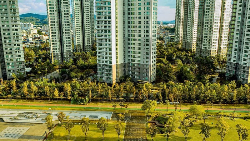 Daejeon, South Korea, September 24, 2020: For editorial use only Aerial view of park with fountain with ExlluTower apartments in background, Asia