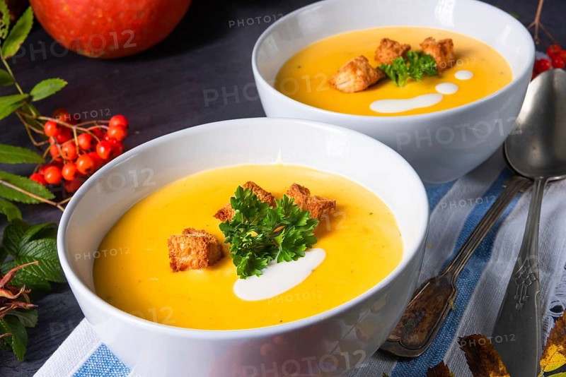 Delicious pumpkin soup with croutons and coconut milk