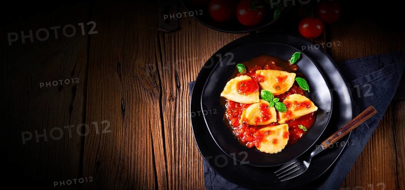 Ravioli alla genovese with basil and tomato sauce