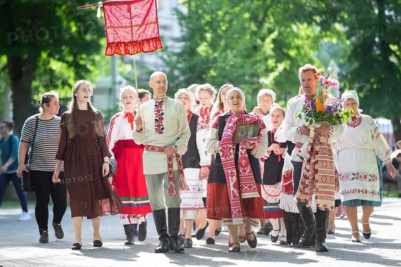 People in Belarusian national costumes perform a national ethnic ritual