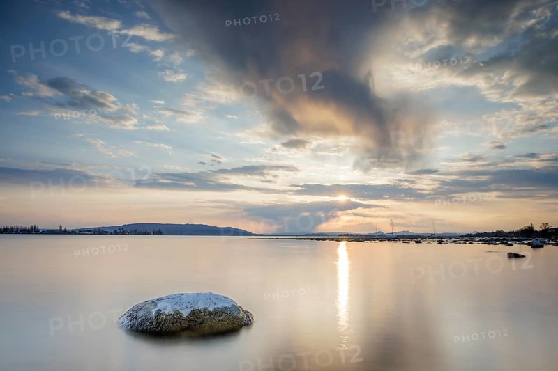 Sunset over a lake, dramatic clouds form in the sky, Seegarten, Allensbach, Lake Constance, Baden-Württemberg, Germany, Europe