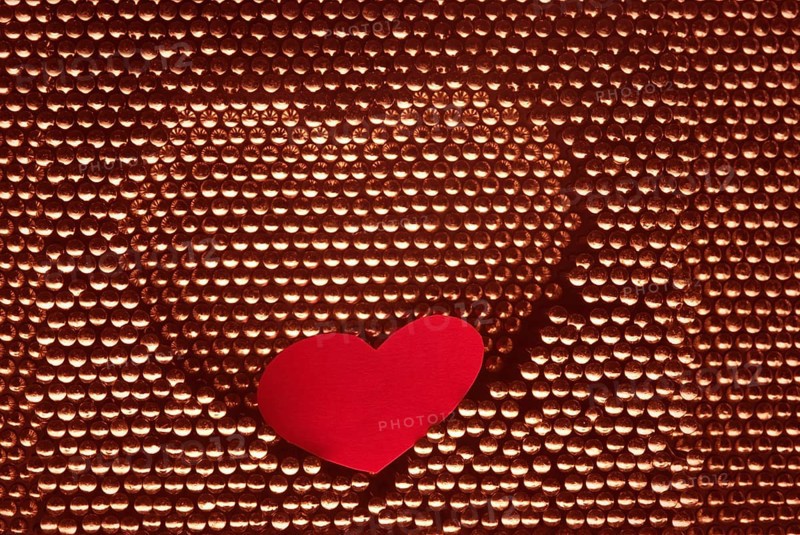 Red paper heart into steel herat shape. hand made by steel nail.