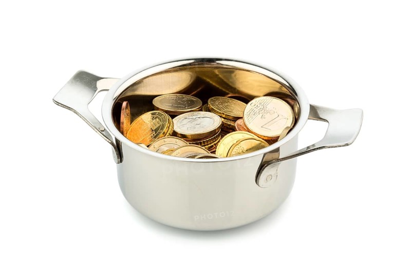 A cooking pot half-filled with euro coins, symbolising national debt and financial needs