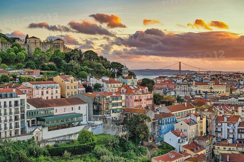 Lisbon Portugal sunset city skyline at Lisbon Baixa district and Saint George Castle