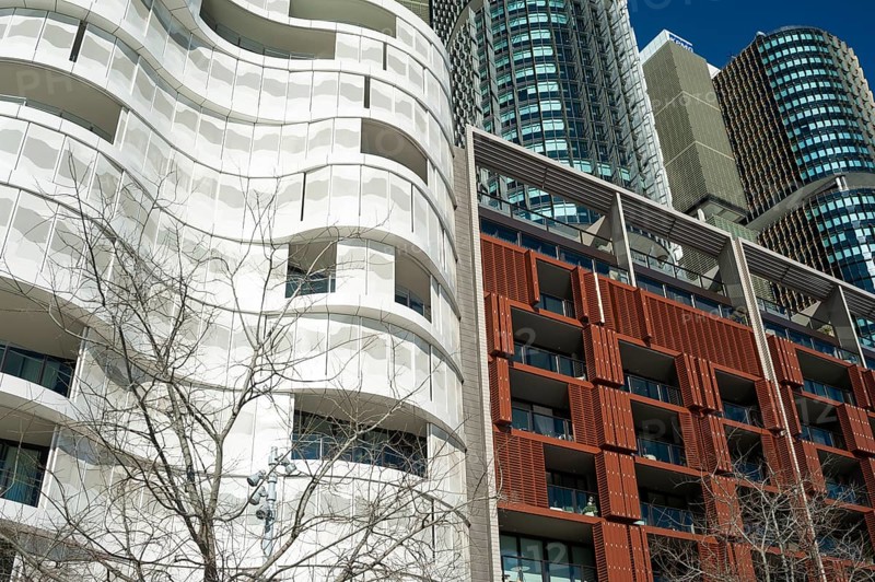 16 Sep 2018, Sydney, New South Wales, Australia, A view of modern residential buildings at Anadara Residence, office towers and restaurants along the pedestrianised Wulugul Walk in Barangaroo South. The buildings are located on the banks of Darling Harbour with the International Towers towering in the background, Oceania
