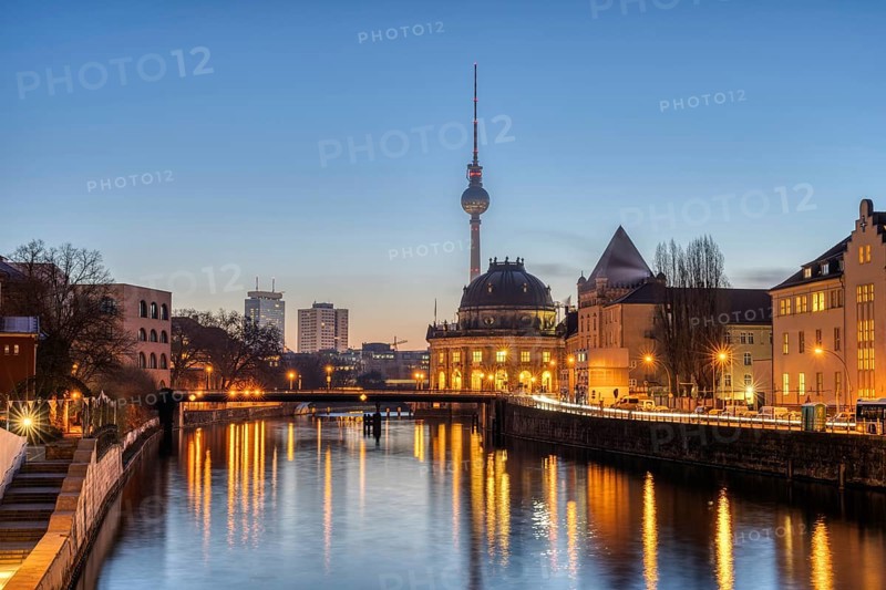 The Spree, the Bode Museum and the television tower in Berlin in front of sunrise