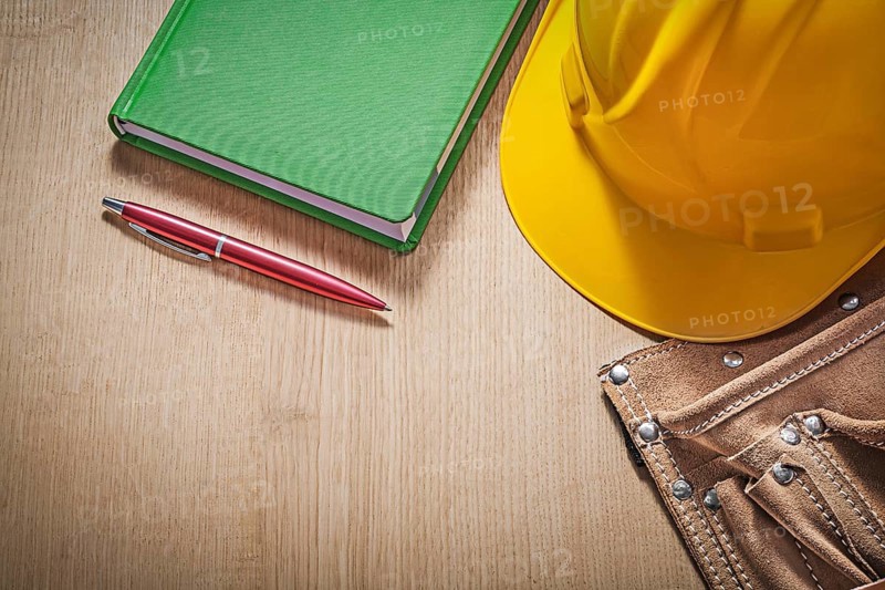 Collection of construction equipment on wood board