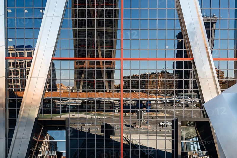 Madrid, Spain, March 20, 2017: Low angle view of The Gate of Europe towers and reflections. They are twin office buildings designed by architect Philip Johnson, Europe