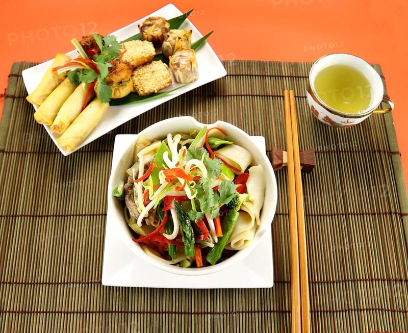 Freshly prepared beef noodle stirfry with dimsums ready to serve