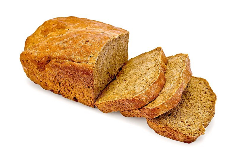 Sliced rye homemade bread isolated on white background