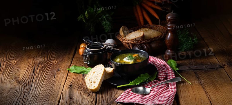 Rustic sorrel soup with potatoes and cream