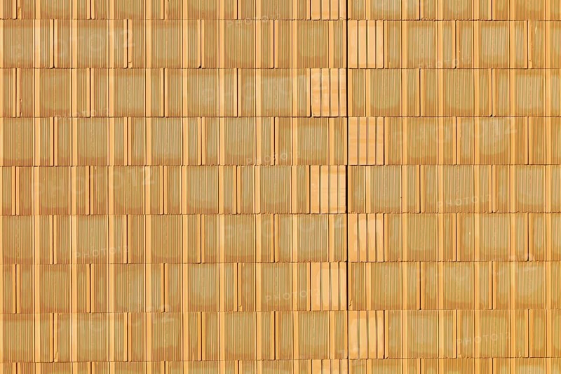 A new brick wall at a building shell house on a construction site. Background. Austria