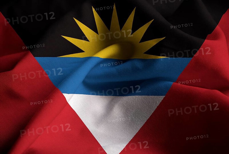 Ruffled Flag of Antigua and Barbuda Blowing in Wind