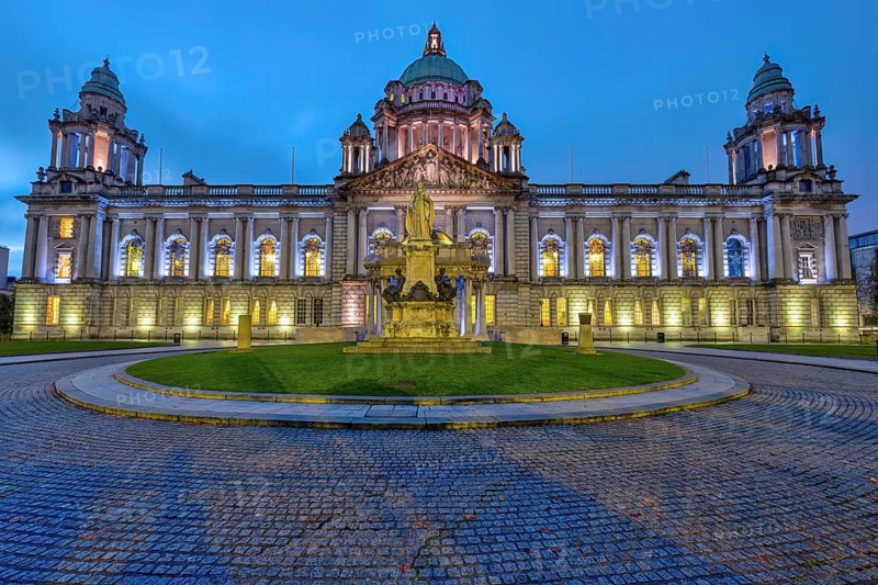 The illuminated Belfast City Hall at dawn
