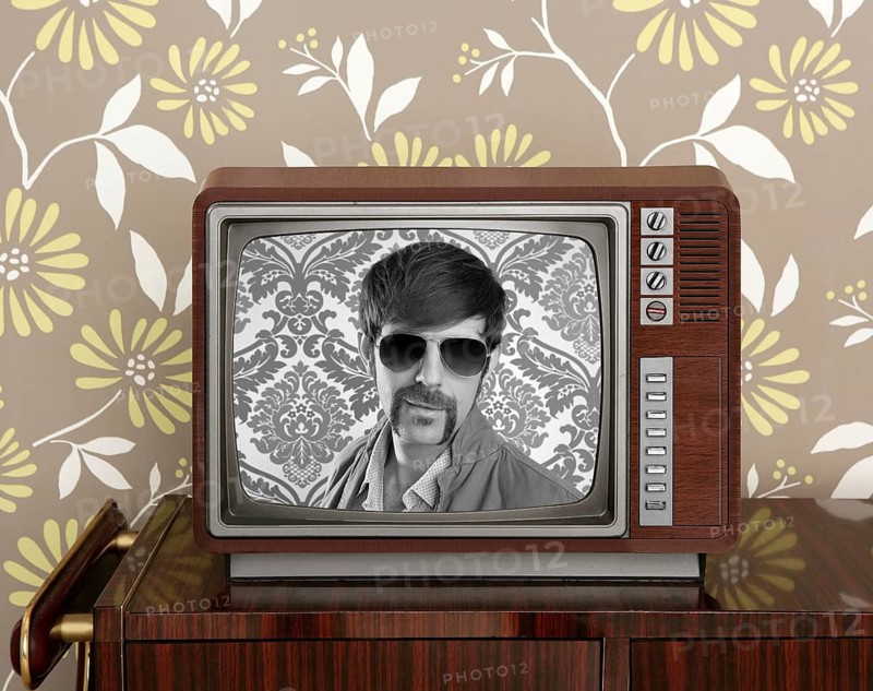 Nerd retro 60s vintage tv presenter hero on wood television wallpaper