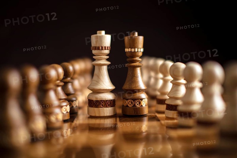 Chess on a dark background. A puzzle game with tricky combinations that requires planning and thinking