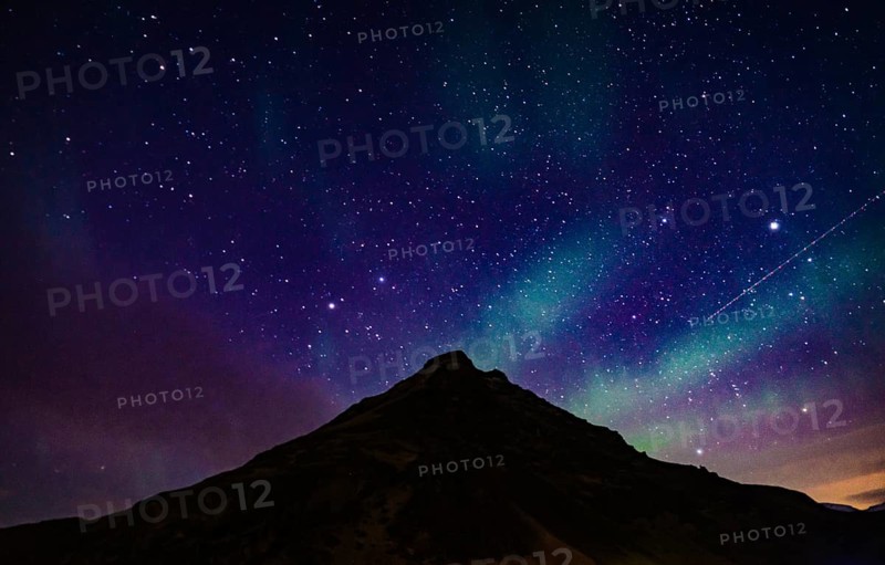 Of Iceland Aurora and mountain silhouette. Shooting Location: Iceland, Reykjavik