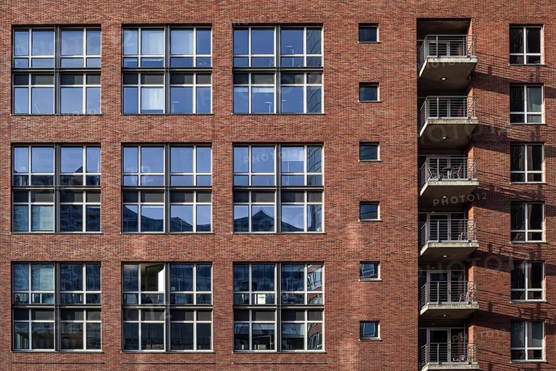 House facade in hamburg's Speicherstadt - reflection in the windows of the elbphilharmonie concert hall