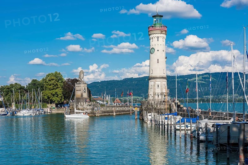 GERMANY, LINDAU - AUGUST 21: view of the lighthouse and a lion statue at the entrance to the port of Lindau at lake Constance, Bodensee on August 21, 2015