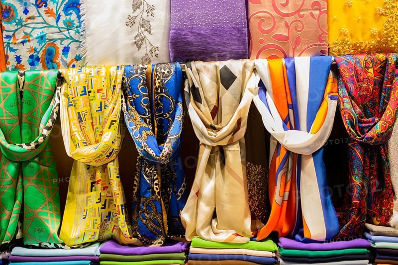 Pile of bright Multi-colored pieces of fabric in a bazaar