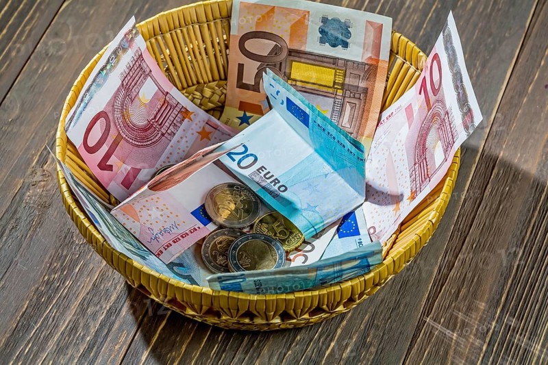 A basket with money for donations and tips Austria
