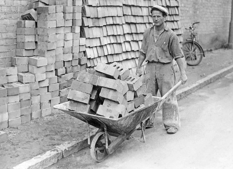 In the 1930s. A man with a wheelbarrow full of bricks. Sweden 1939