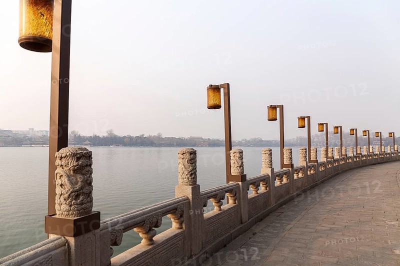 Lamps along a lakeside promenade in Beihai Park, Beijing, China in March 2018, Beijing, China, Asia