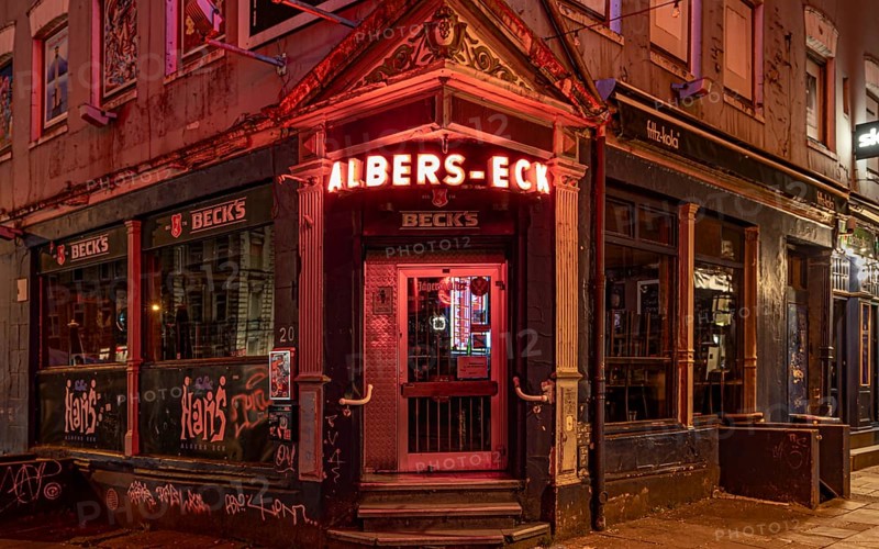 The façade of a traditional Hamburg pub with glowing red neon lights at night, Hans-Albers-Eck, St. Pauli, Free and Hanseatic City of Hamburg, Germany, Europe