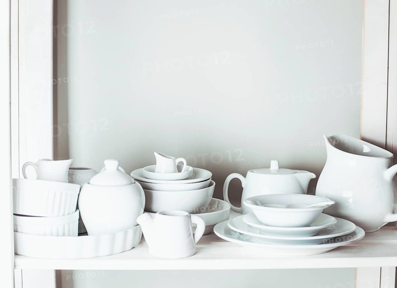 Shelves in the rack in the kitchen at shabby chic style