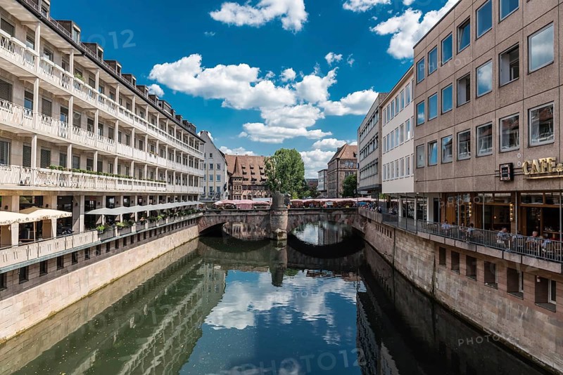 Germany, 07 26 2018: Historical buildings reflecting at the banks of the river Pegnitz, Europe