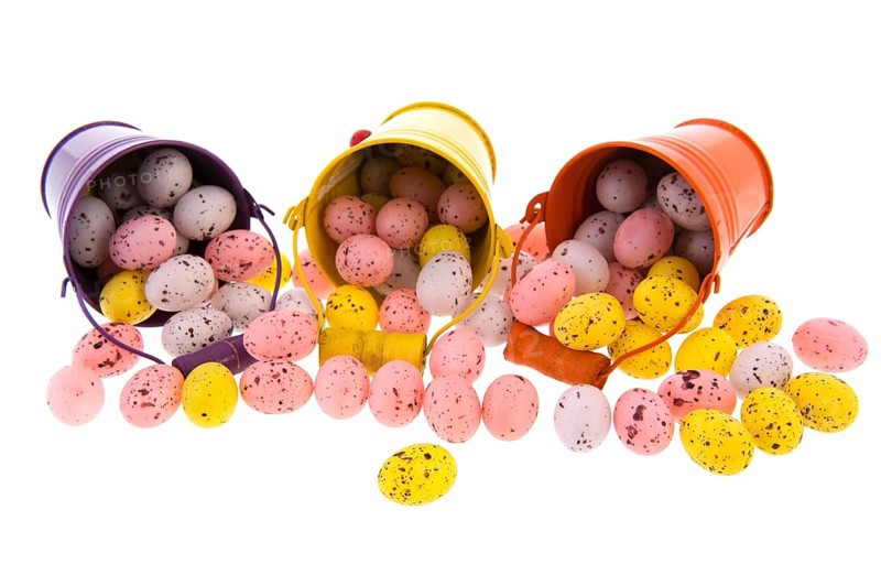 Colorful metal buckets with easter eggs