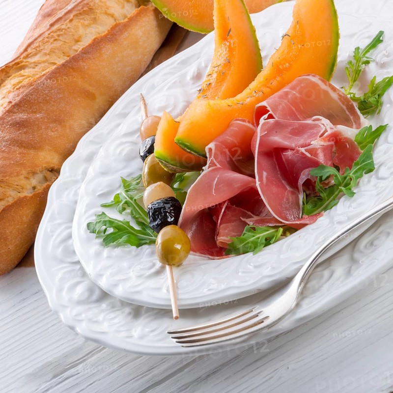 Ham with melon and olives